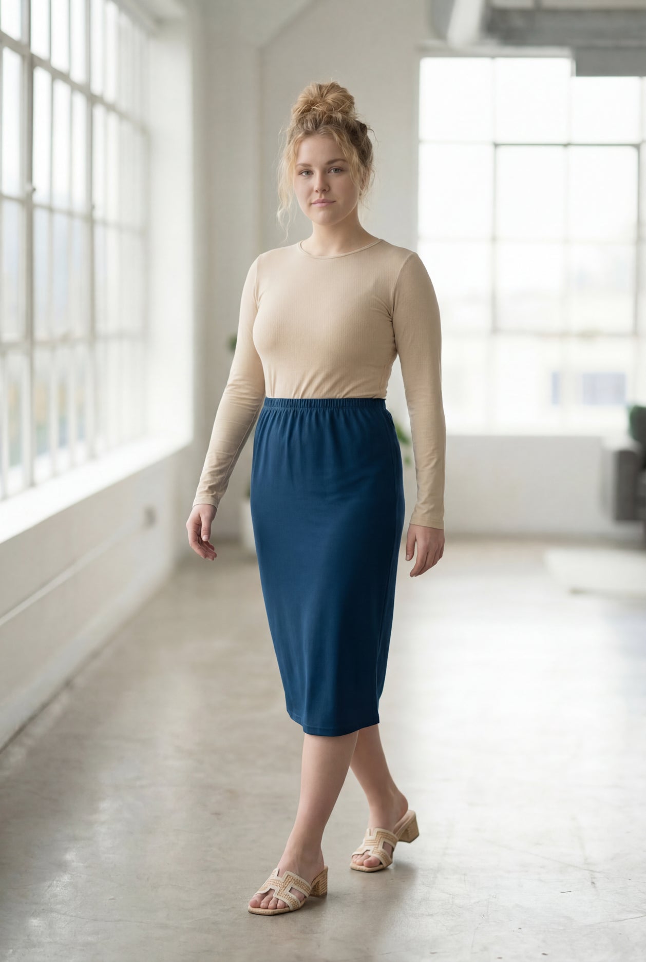 Model wearing Nuggles® 27" Classic Skirt in  Peacock Blue