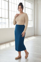 Model wearing Nuggles® 31" Classic Skirt in Peacock Blue