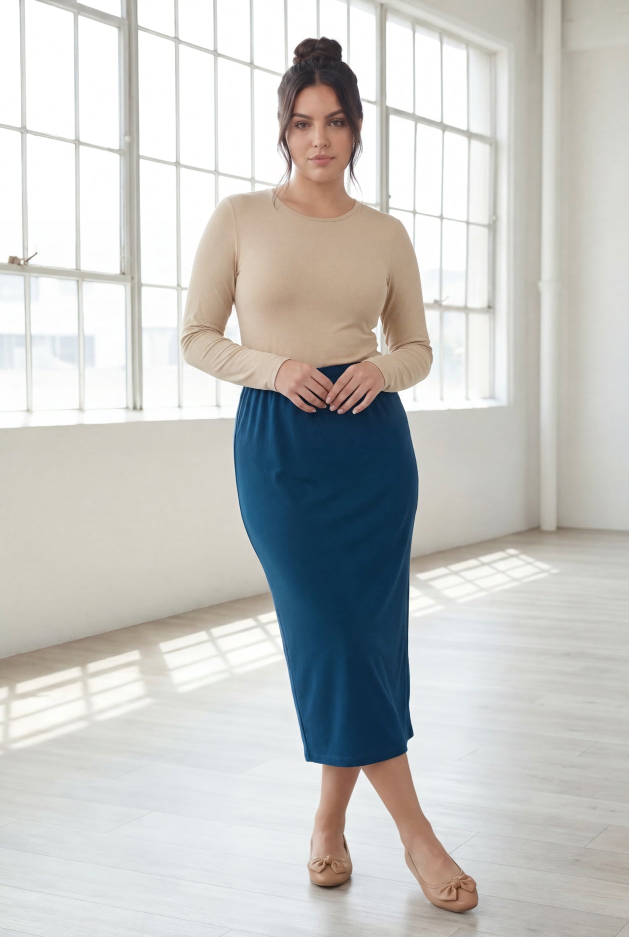 Model wearing Nuggles® 31" Classic Skirt in Peacock Blue