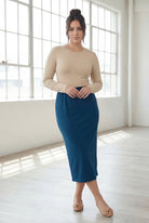 Model wearing Nuggles® 31" Classic Skirt in Peacock Blue