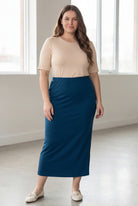 Model wearing Nuggles® 34" Classic Skirt in Peacock blue