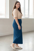 Model wearing Nuggles® 34" Classic Skirt in Peacock blue