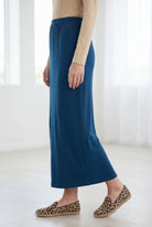 Model wearing Nuggles® 36" Classic Skirt in Peacock