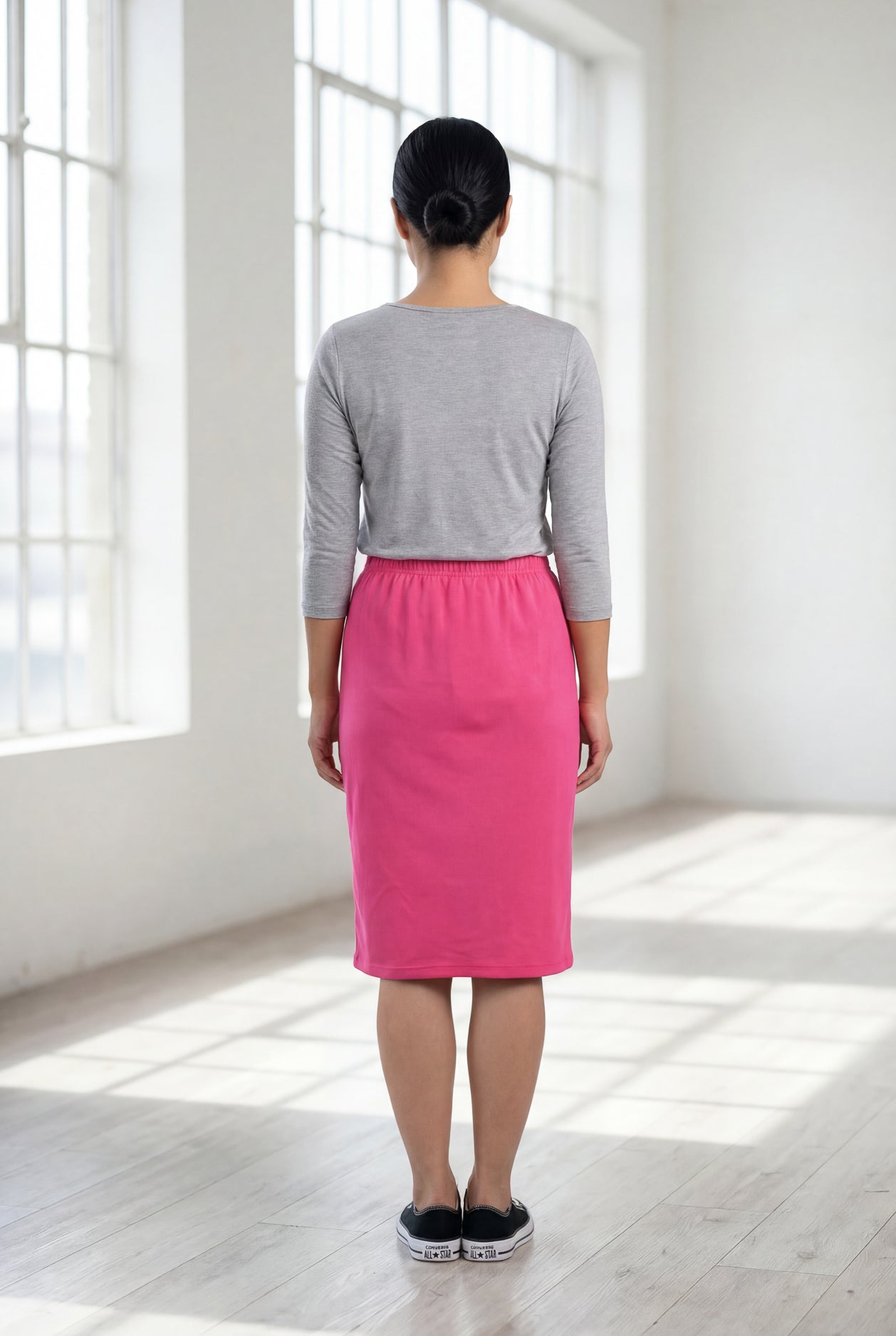 Model wearing Nuggles® 25" Classic Skirt in Pink