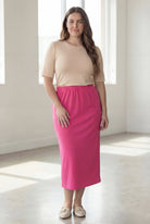 Model wearing Nuggles® 34" Classic Skirt in Pink