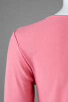 Model wearing Nuggles® 3/4 Essential Ribbed Tee in Pink