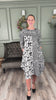 The Nuggles® Bailey Dress try on video a modest midi length, two tone with cowl neckline