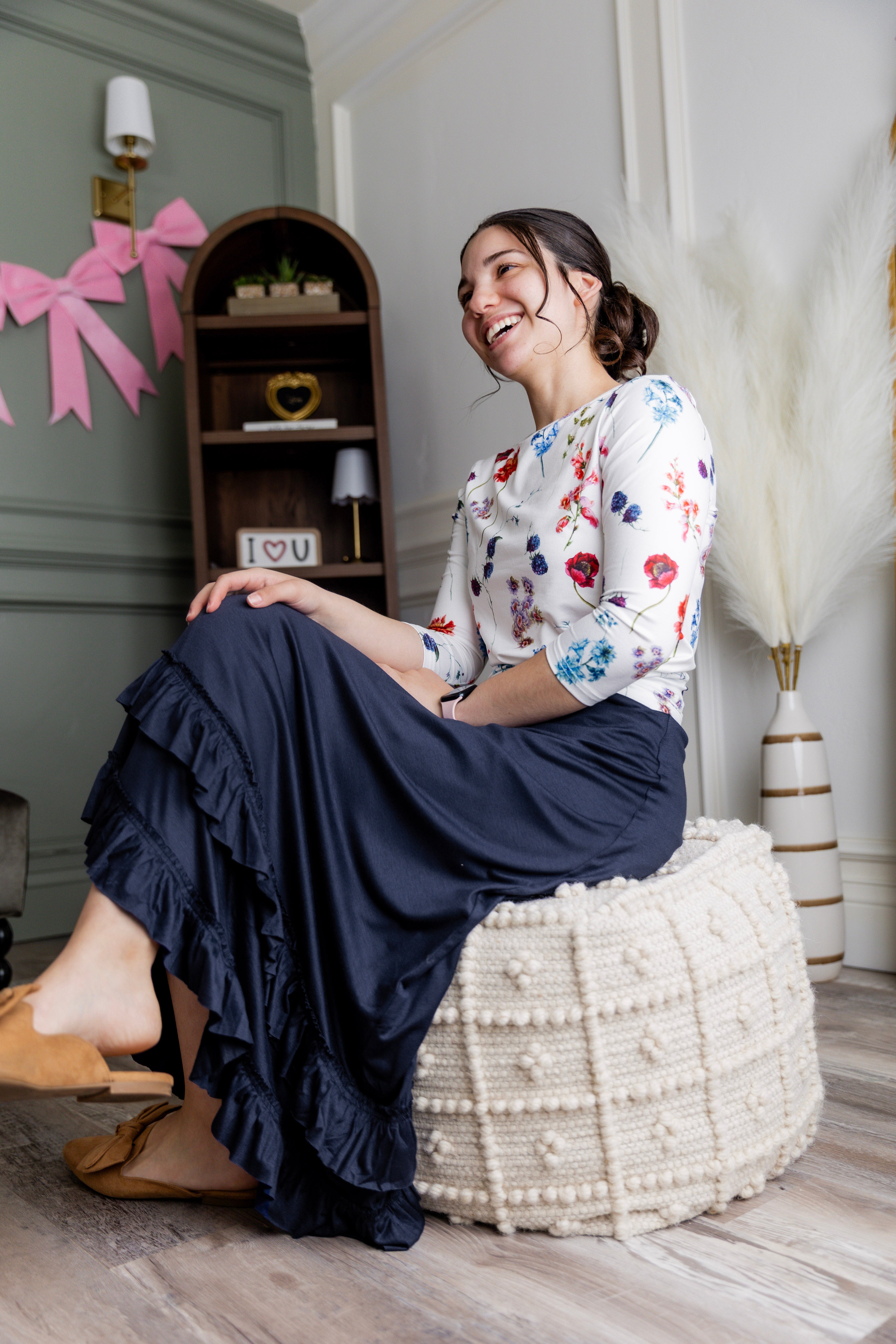 Try-on video of the Nuggles® Callie Skirt showing a fully lined, flowy maxi skirt with a ruffle hem and comfortable elastic waistband