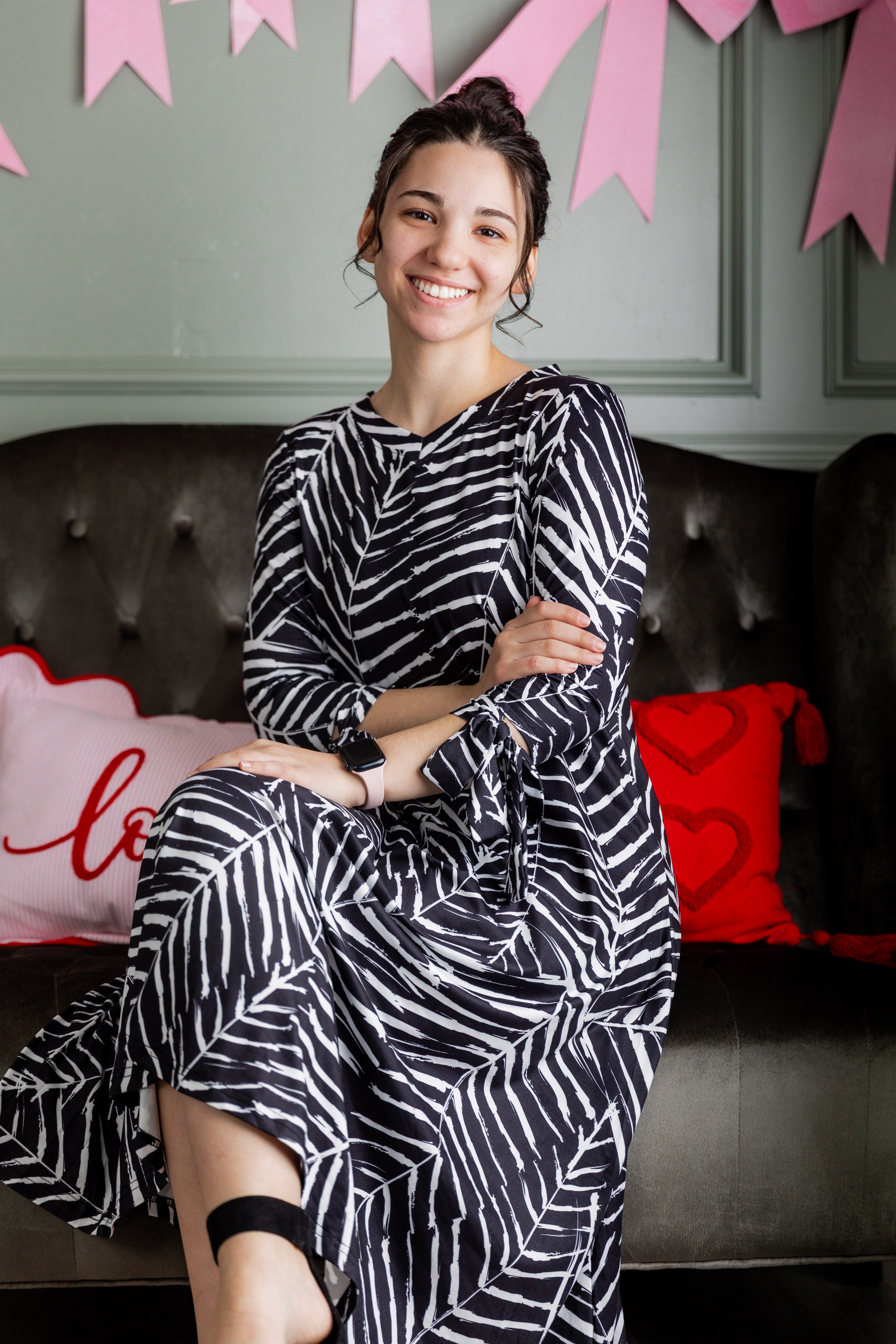 Try on video of model wearing Nuggles® Hazel Dress in Confetti Garden Bloom print with bow-tie sleeves