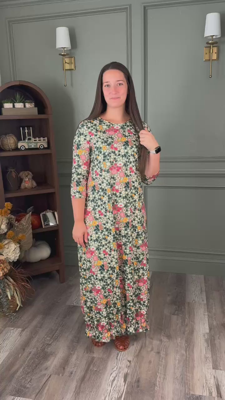 Nuggles® Maxi Bristol Dress try-on video highlighting A-line cut, three-quarter sleeves, and ruffle hem.