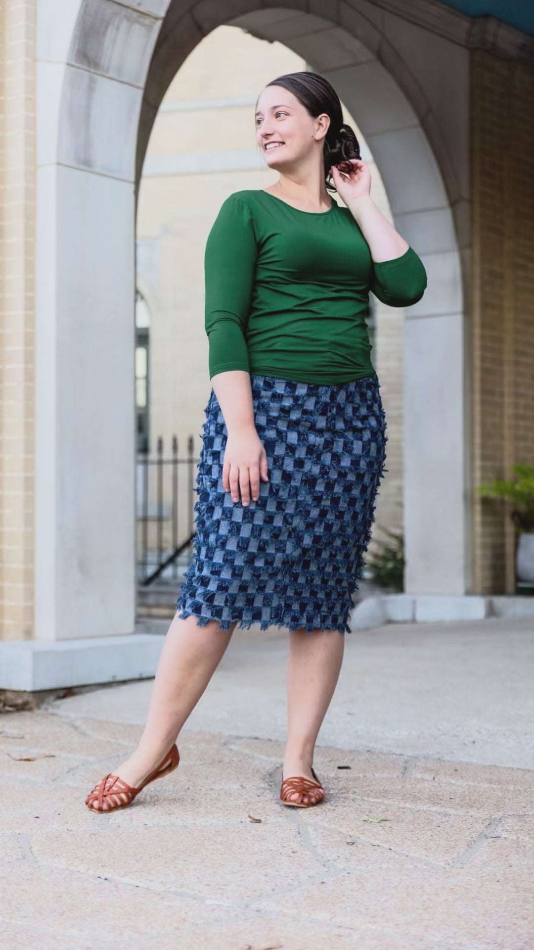Video showcasing the Nuggles®  denim midi skirt in motion, highlighting its stretch fabric, modest fit, and versatile styling in various angles.