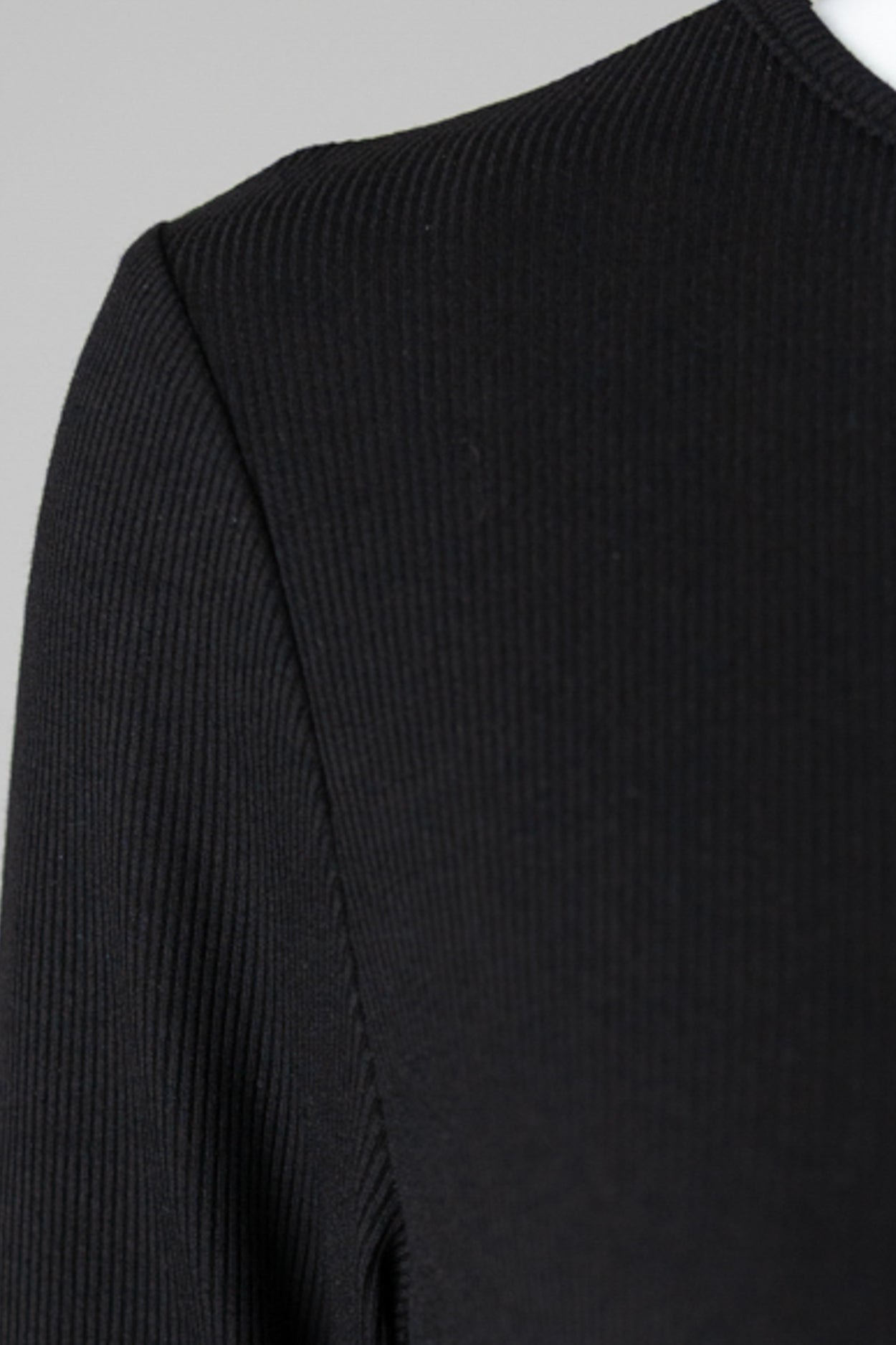 Model wearing Nuggles® 3/4 Essential Ribbed Tee in Black
