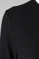 Model wearing Nuggles® 3/4 Essential Ribbed Tee in Black