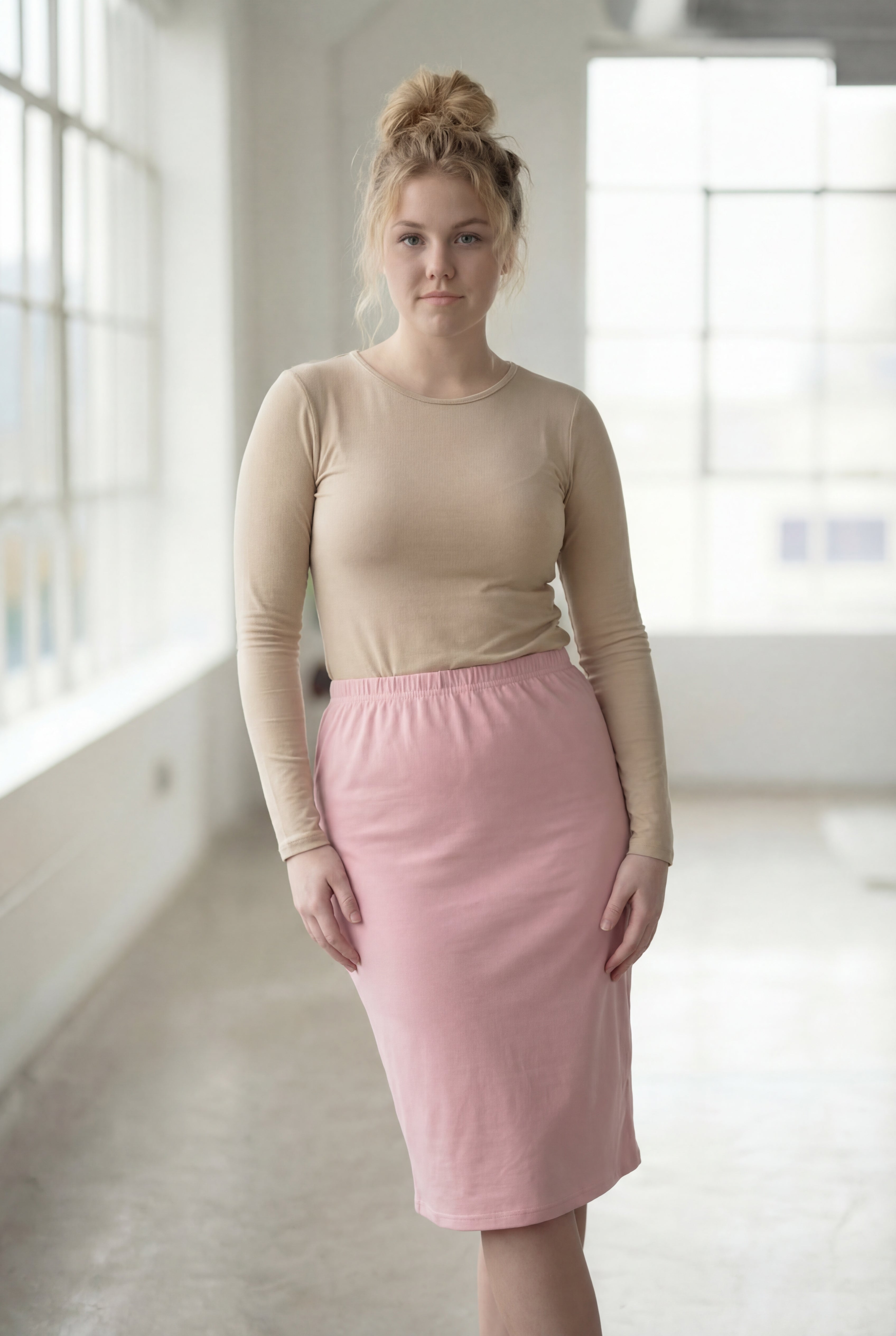 Women wearing a pink rose classic 27" midi length skirt with a beige shirt in a sunlight loft.