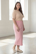 Model wearing Nuggles® 34" Classic Skirt in  Rose