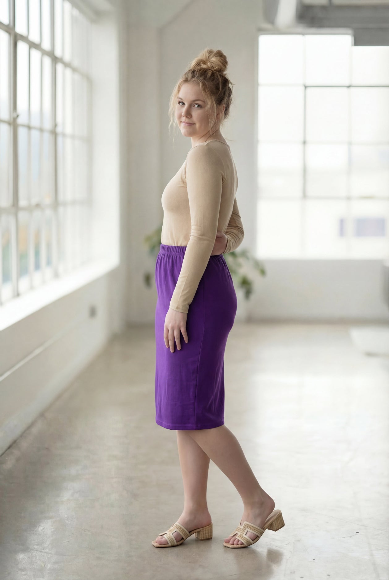Model wearing Nuggles® 27" Classic Skirt  in Royal Purple