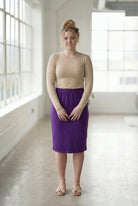 Model wearing Nuggles® 27" Classic Skirt  in Royal Purple