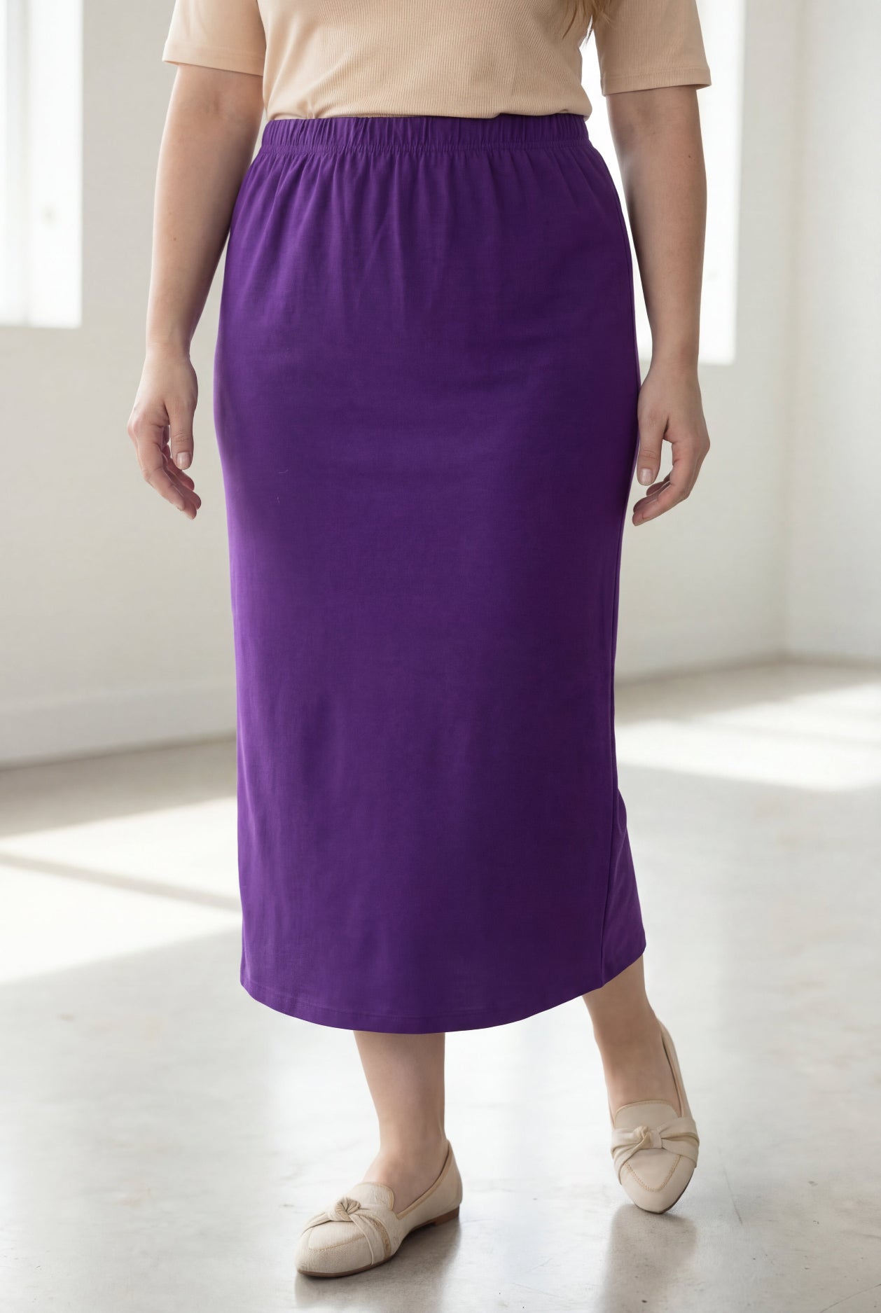 Model wearing Nuggles® 34" Classic Skirt in Royal Purple