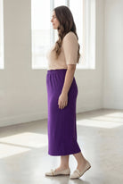 Model wearing Nuggles® 34" Classic Skirt in Royal Purple