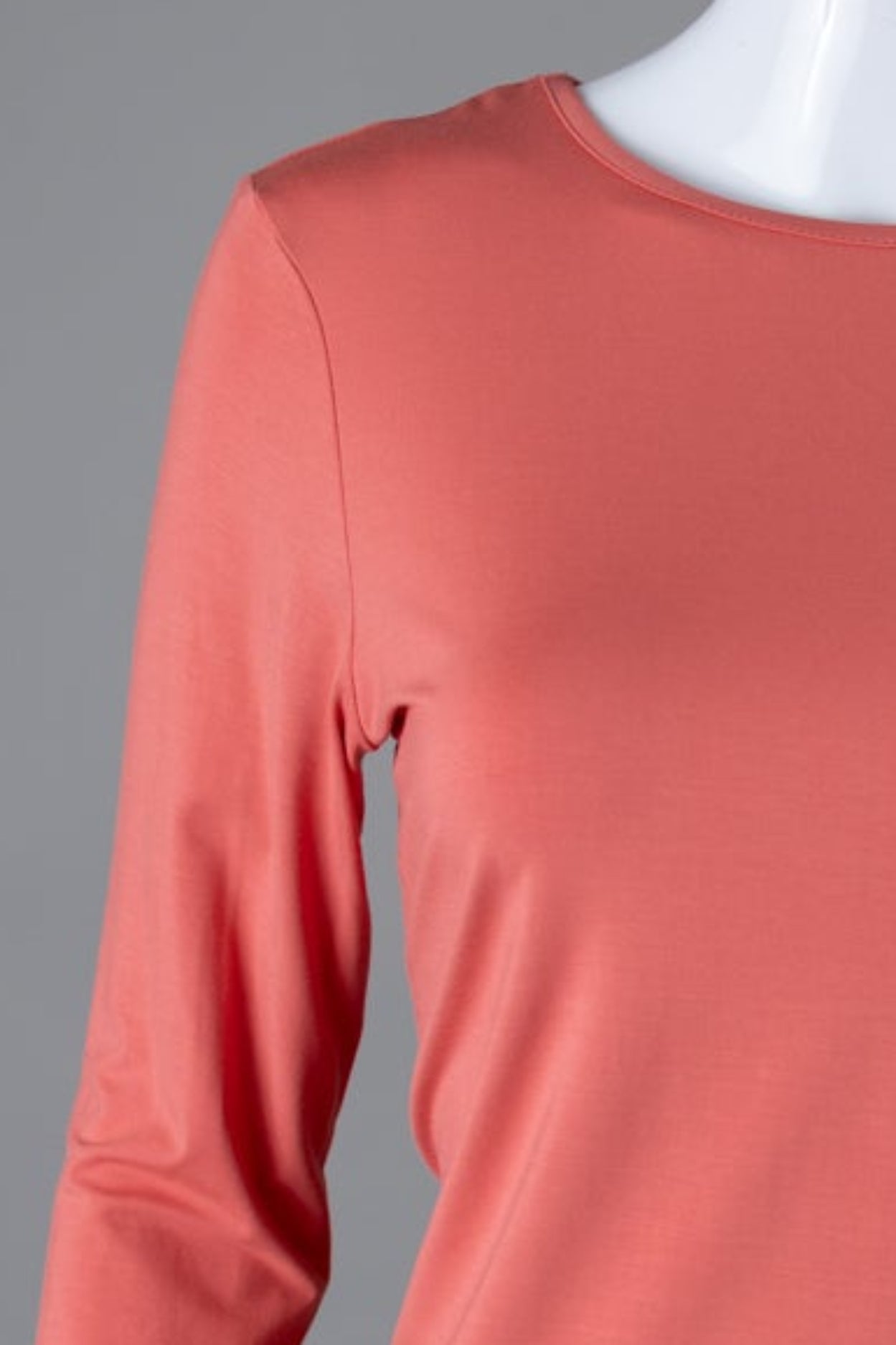 Model wearing Nuggles® 3/4 Essential Tee in Salmon