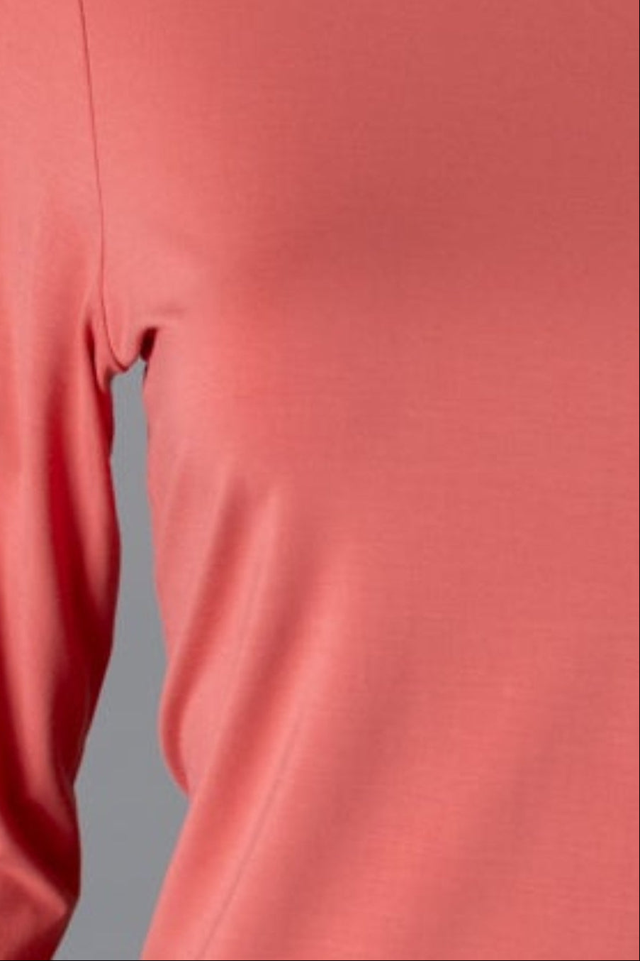Model wearing Nuggles® 3/4 Essential Tee in Salmon