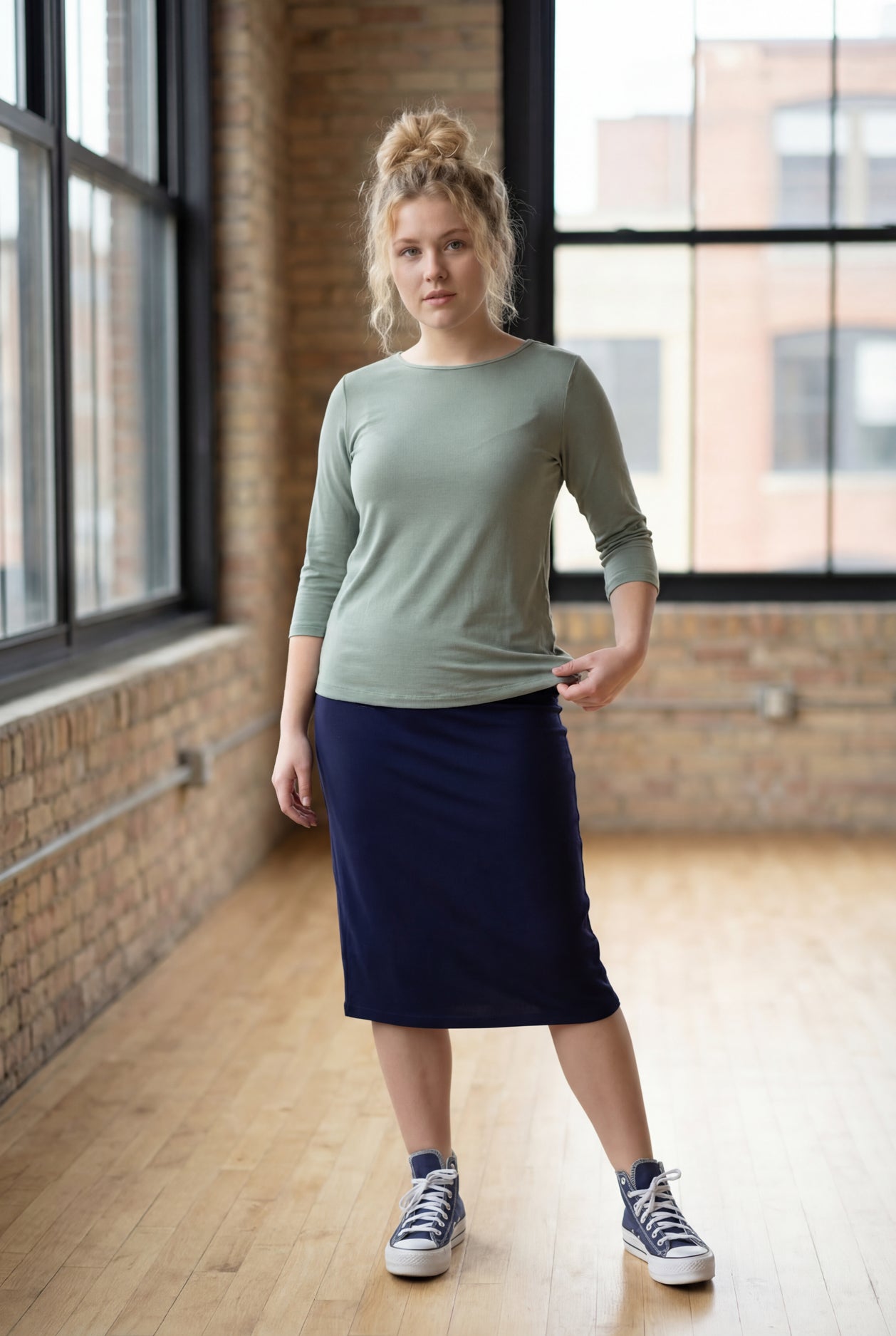 Model wearing the Nuggles® Essential 3/4 Tee in seafoam green