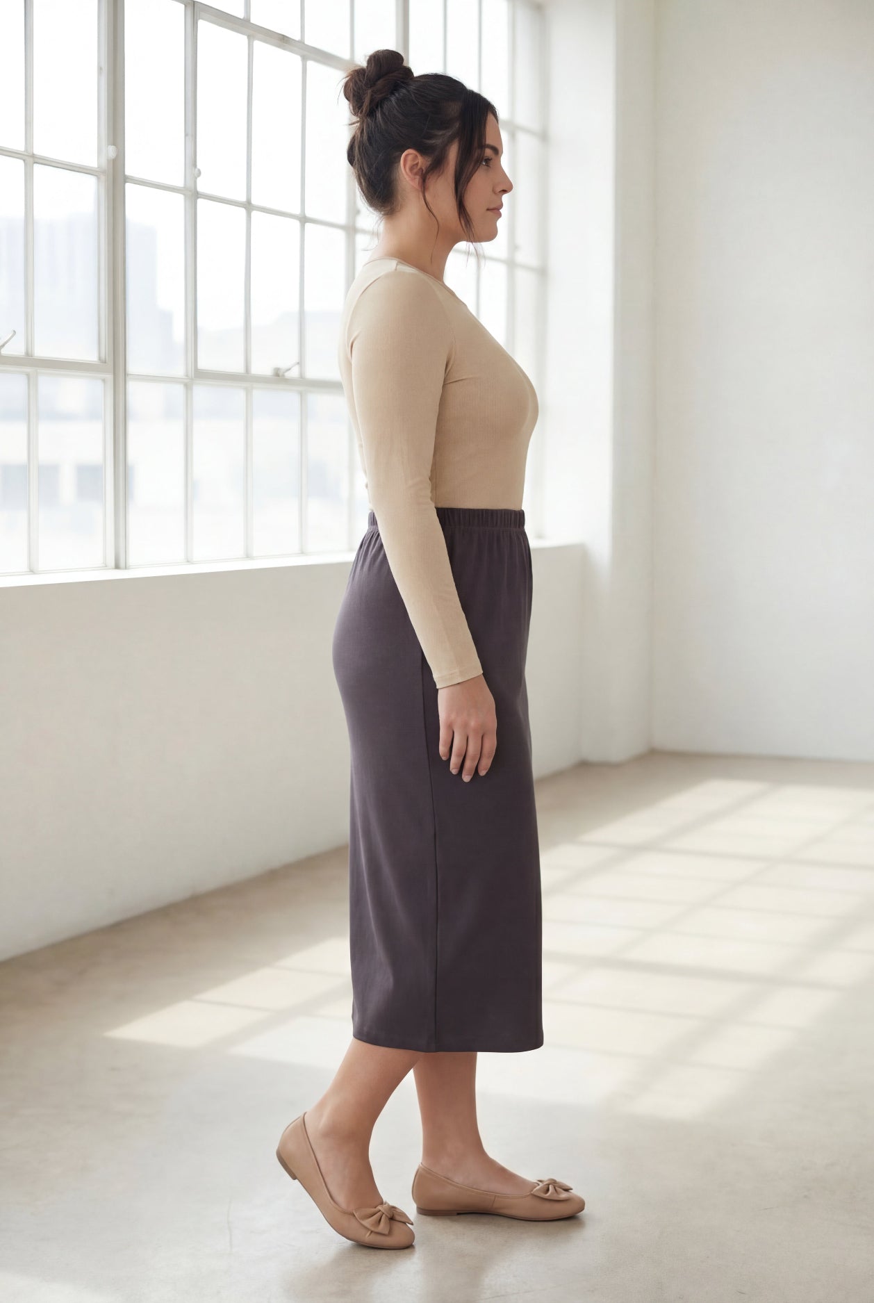 Model wearing Nuggles® 31" Classic Skirt  in Steel Gray