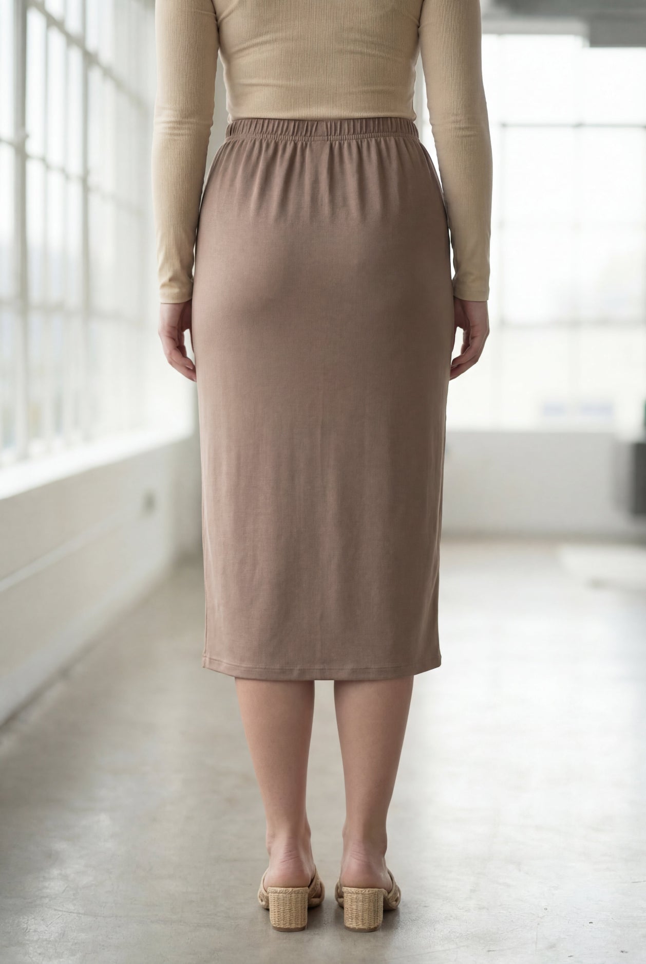 Model wearing Nuggles® 27" Classic Skirt  in Taupe