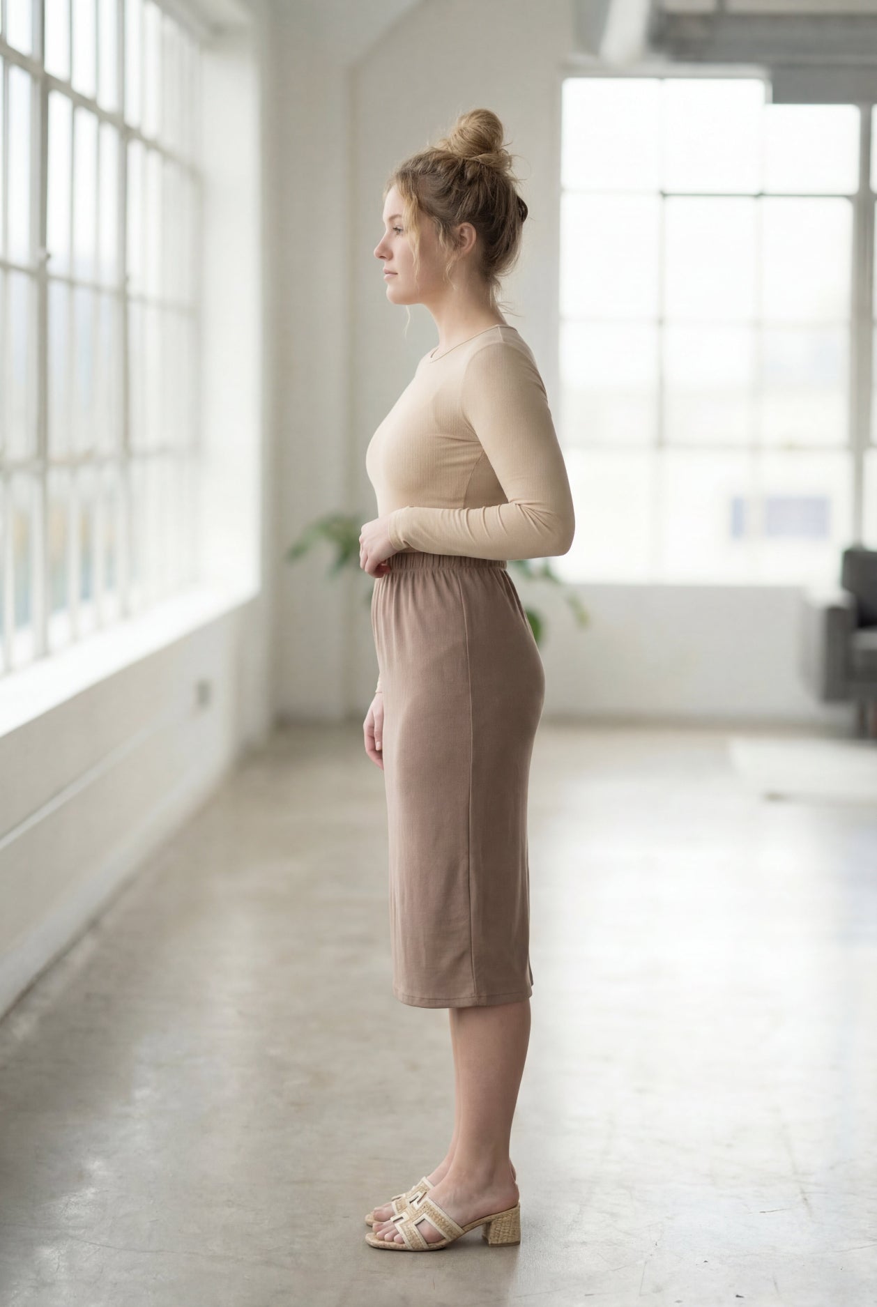 Model wearing Nuggles® 27" Classic Skirt  in Taupe