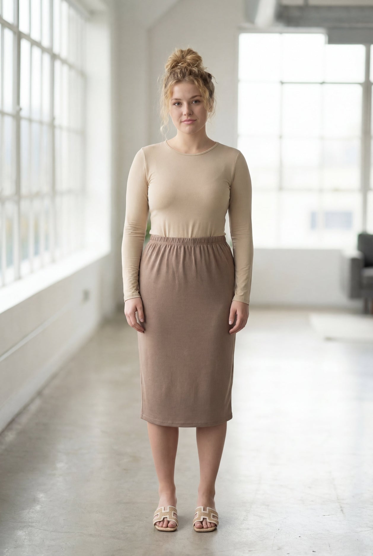 Model wearing Nuggles® 27" Classic Skirt  in Taupe