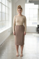 Model wearing Nuggles® 27" Classic Skirt  in Taupe