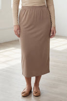 Model wearing Nuggles® 31" Classic Skirt  in Taupe
