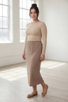 Model wearing Nuggles® 31" Classic Skirt  in Taupe