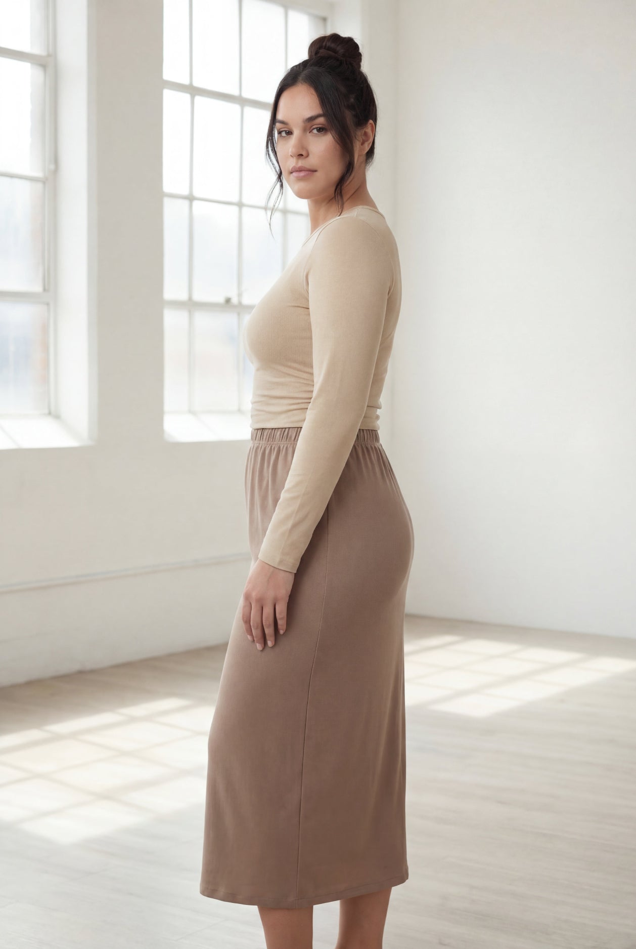 Model wearing Nuggles® 31" Classic Skirt  in Taupe