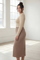 Model wearing Nuggles® 31" Classic Skirt  in Taupe