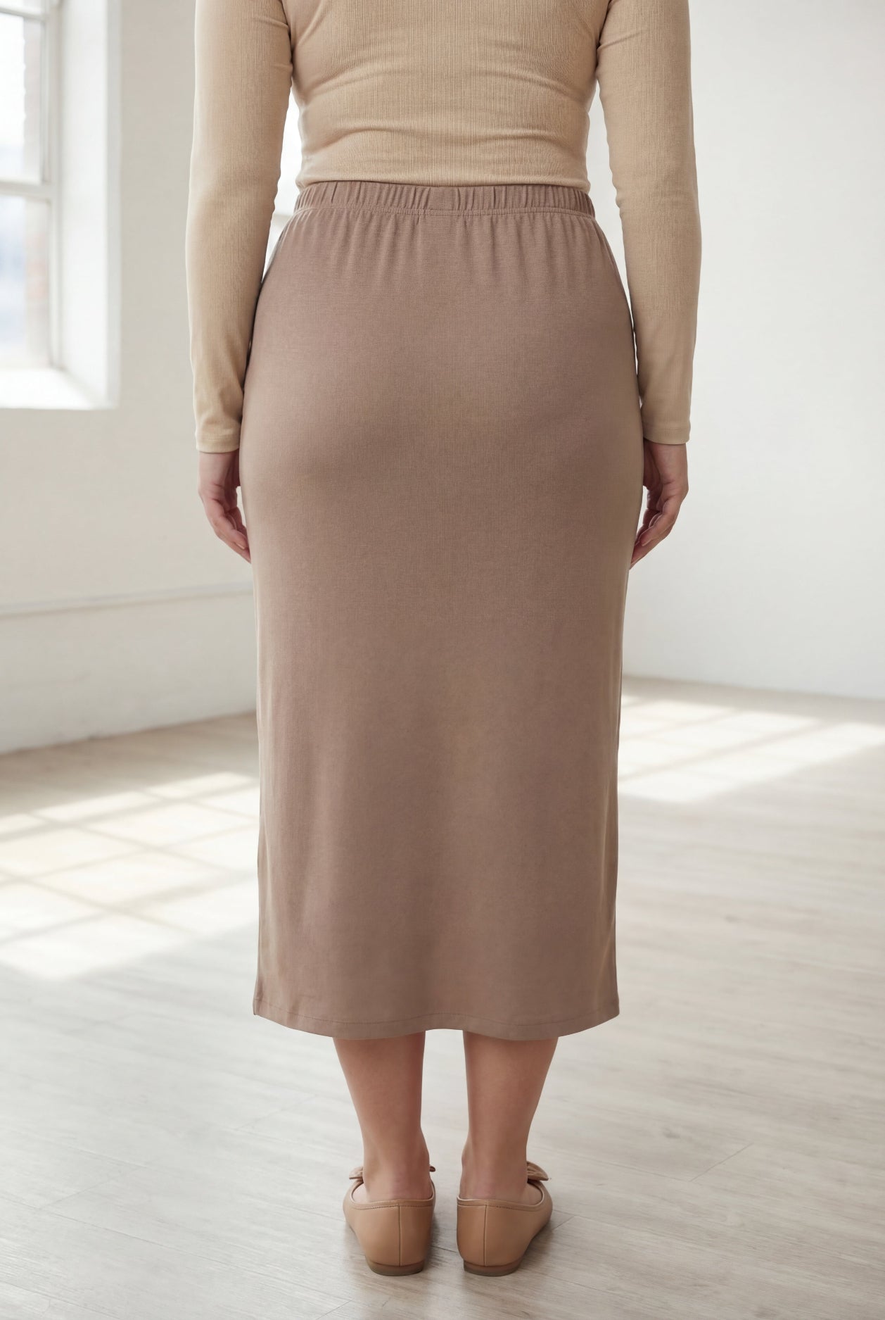 Model wearing Nuggles® 31" Classic Skirt  in Taupe