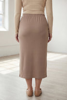 Model wearing Nuggles® 31" Classic Skirt  in Taupe
