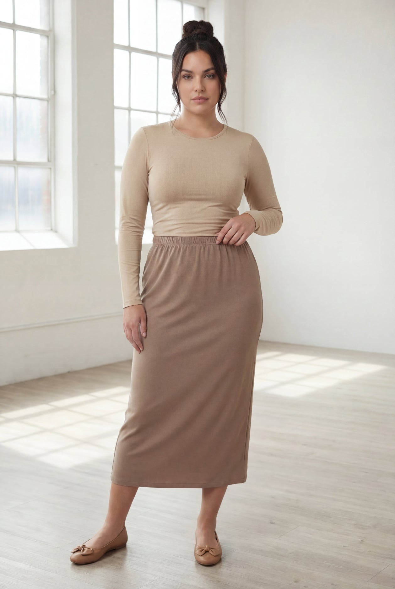 Model wearing Nuggles® 31" Classic Skirt  in Taupe
