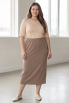 Model wearing Nuggles® 34" Classic Skirt  in Taupe