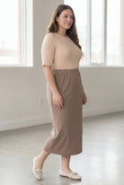 Model wearing Nuggles® 34" Classic Skirt  in Taupe