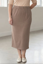 Model wearing Nuggles® 34" Classic Skirt  in Taupe