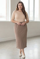 Model wearing Nuggles® 34" Classic Skirt  in Taupe