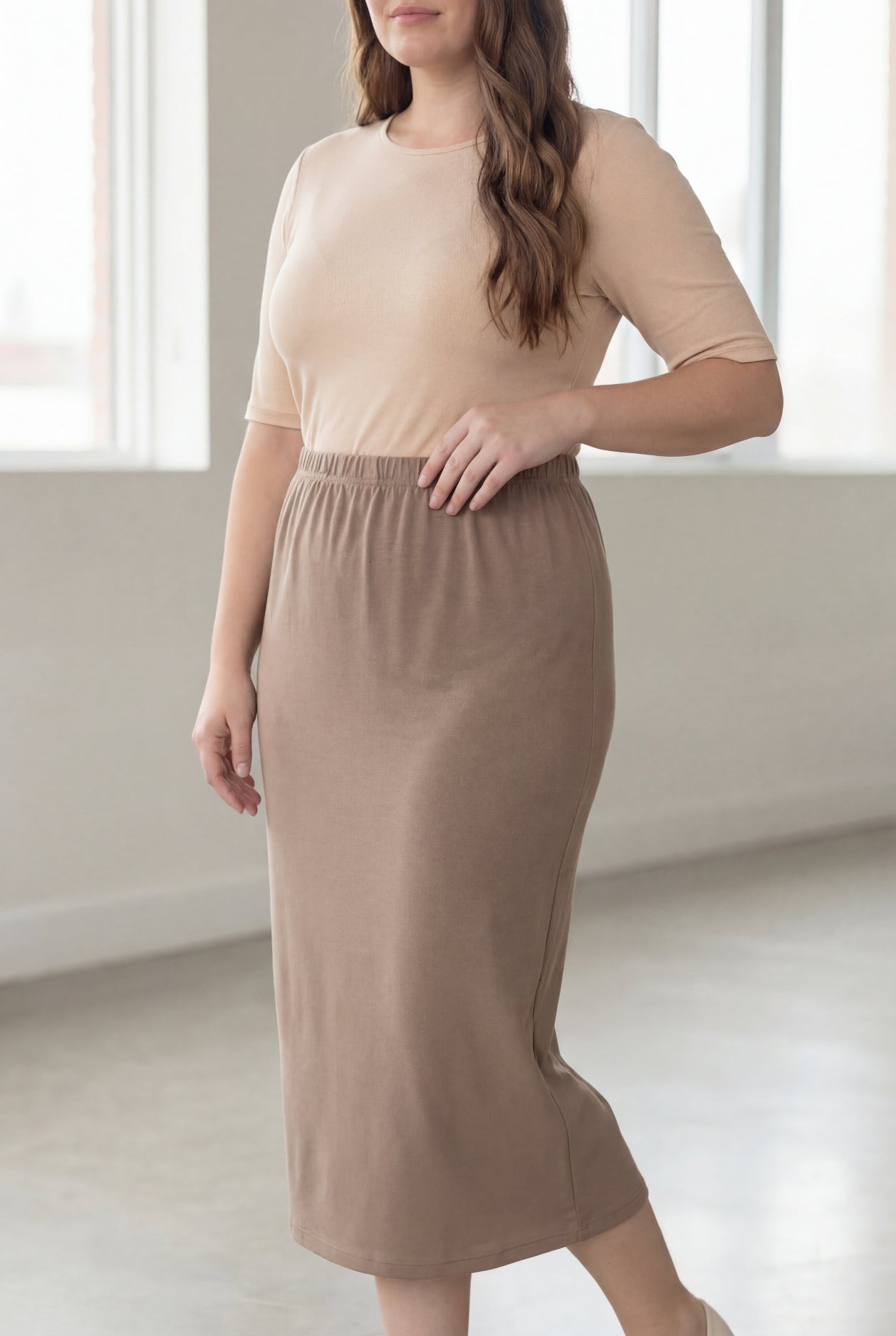 Model wearing Nuggles® 34" Classic Skirt  in Taupe