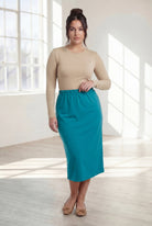 Model wearing Nuggles® 31" Classic Skirt in Teal