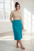 Model wearing Nuggles® 31" Classic Skirt in Teal