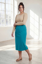 Model wearing Nuggles® 31" Classic Skirt in Teal