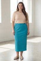 Model wearing Nuggles® 34" Classic Skirt in Teal