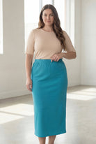 Model wearing Nuggles® 34" Classic Skirt in Teal