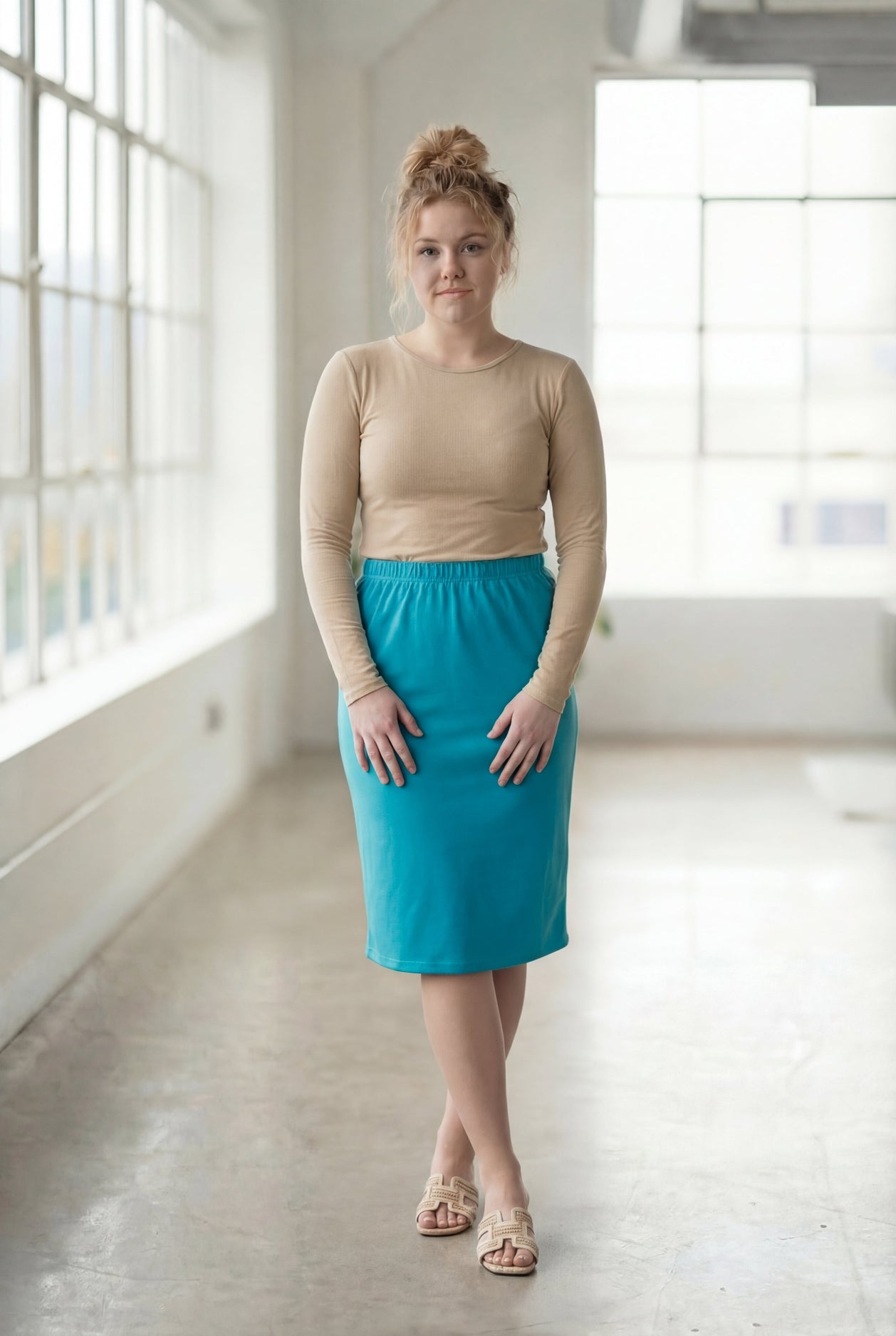 Model wearing Nuggles® 27" Classic Skirt in Teal