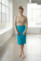 Model wearing Nuggles® 27" Classic Skirt in Teal